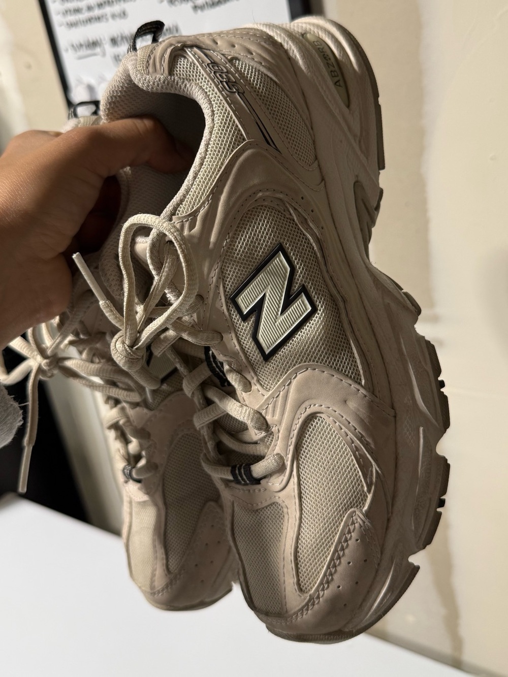 New Balance Beige and Black Athletic Sneakers